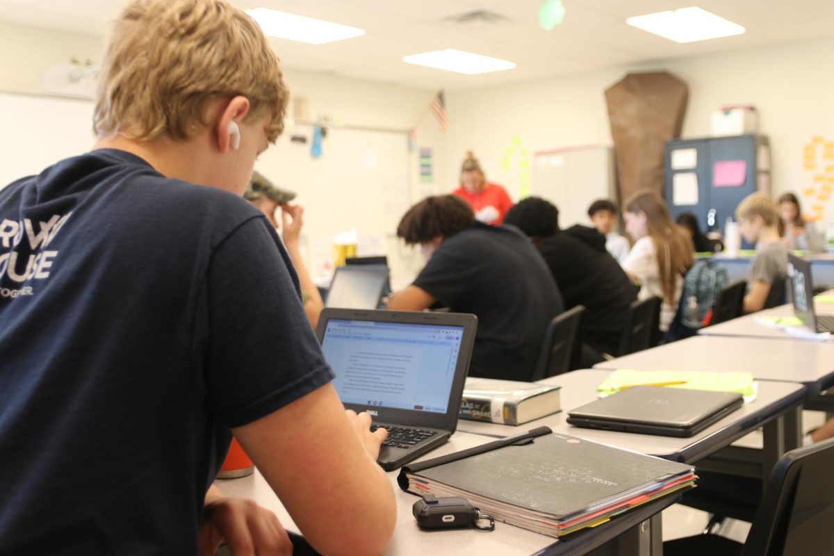 Freddie Garris, freshman, uses the same Chromebook he had in middle school to complete an assignment in Laurie Schultzs Ninth Grade Language Arts class. This year, incoming freshmen havent received new Chromebooks, but if Prop 3 passes, money will go toward supporting technology such as Chromebook distribution. 
