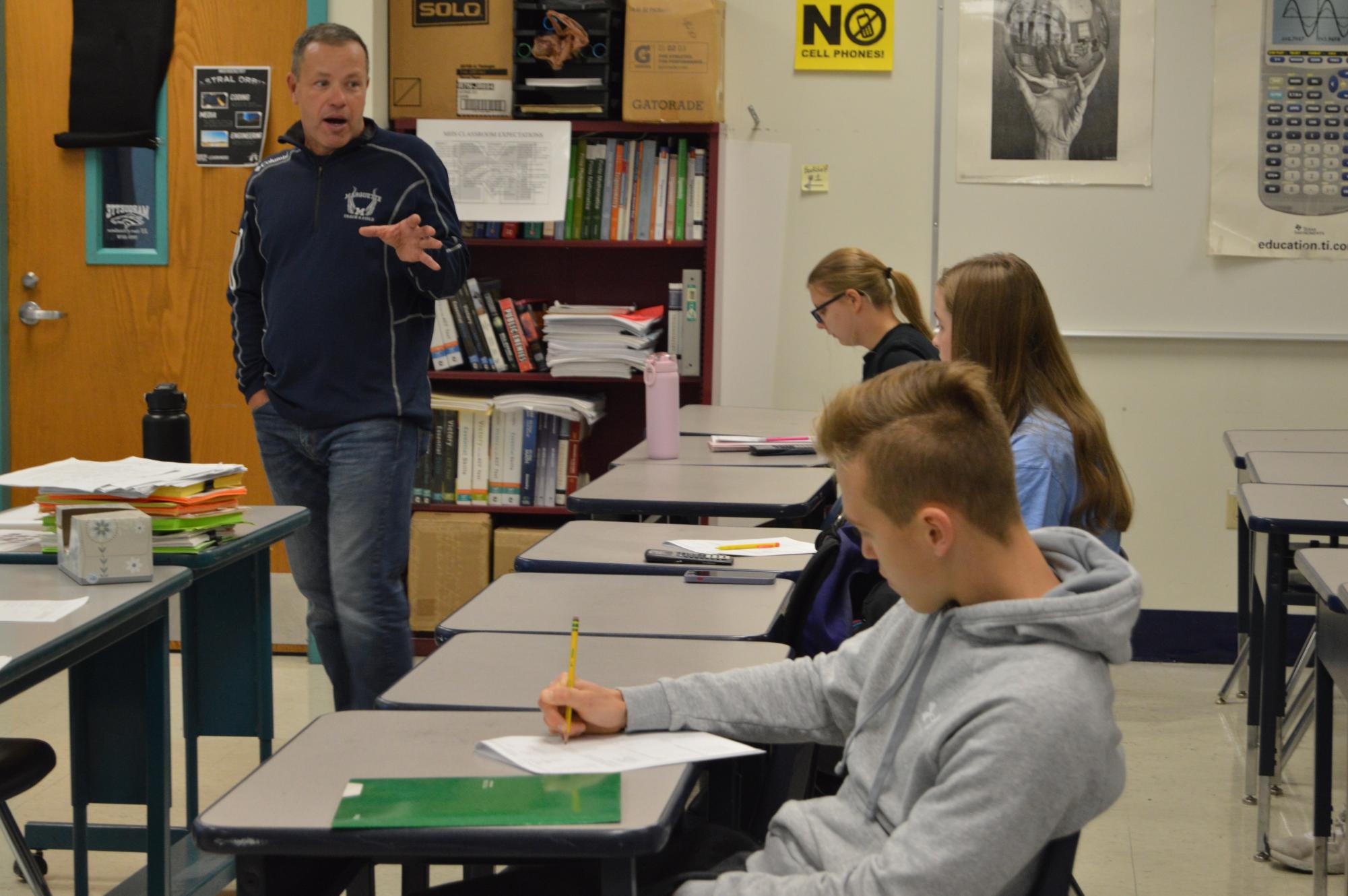 Matt Nienhaus, math teacher, explains commonly missed questions to his ACT prep class before school on Thursday, Oct. 19. MHS ACT scores have risen to 24.3 from 2022 to 2023. This doesn’t follow the national trend of a decrease in average scores. 