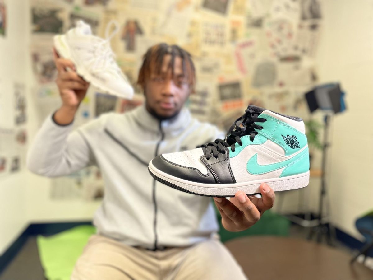 Frederick McCullough II, senior, showcases his favorite pair of Nike sneakers: Air Jordan 1 High OG Rebellionaire in Tropical Twist. This show was first seen in 1985.