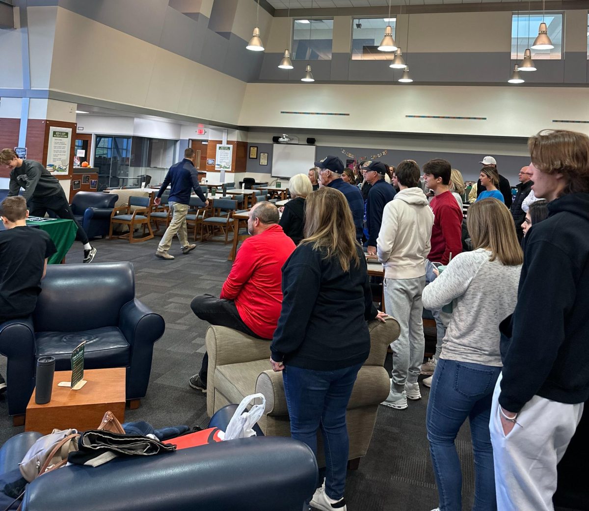 The MHS community gathers in the library on Monday, Nov. 27 to celebrate Winter Signing Day and four student-athletes as they pursue their academic and athletic goals.