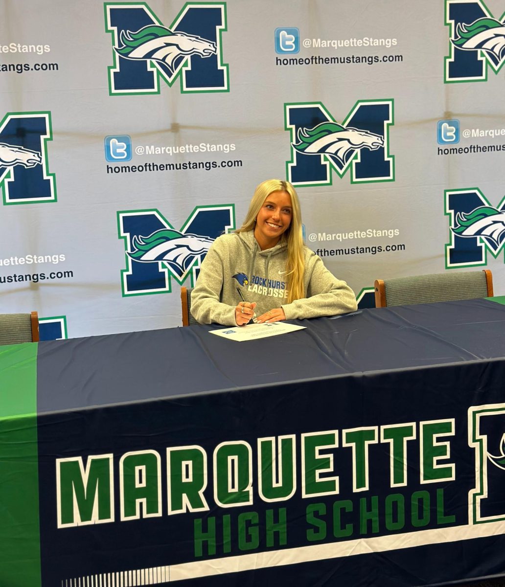 Katie Morgenthaler, senior, flashes a smile during Winter Signing Day on Monday, Nov. 27. She signed to play lacrosse for Rockhurst University.