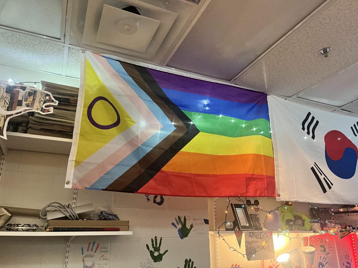 LGBTQ+ support shown by a flag hung in Emily Jorgensen, journalism teachers, room. 