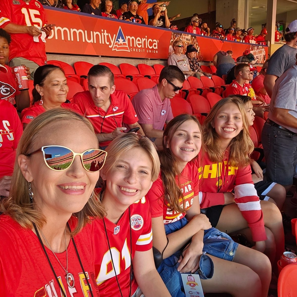 Kara Miller, senior (far right), sits with her family at a Chiefs home game. 