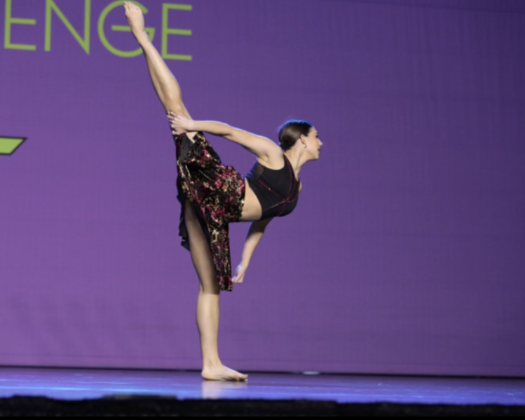 Sophomore Jaden Mitchell performs her solo at Masquerade dance competition. In order to perform, she had to pay a minimum of $100 entrance fee.