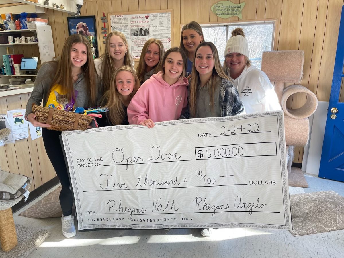 Katelyn Heitert, senior, and a group of friends honor Rhegan Sajben each February by fundraising for different animal shelters. Sajben often volunteered at animal shelters with her family and adopted her dog Billie from a shelter she volunteered at. (Media by Laura Heitert)