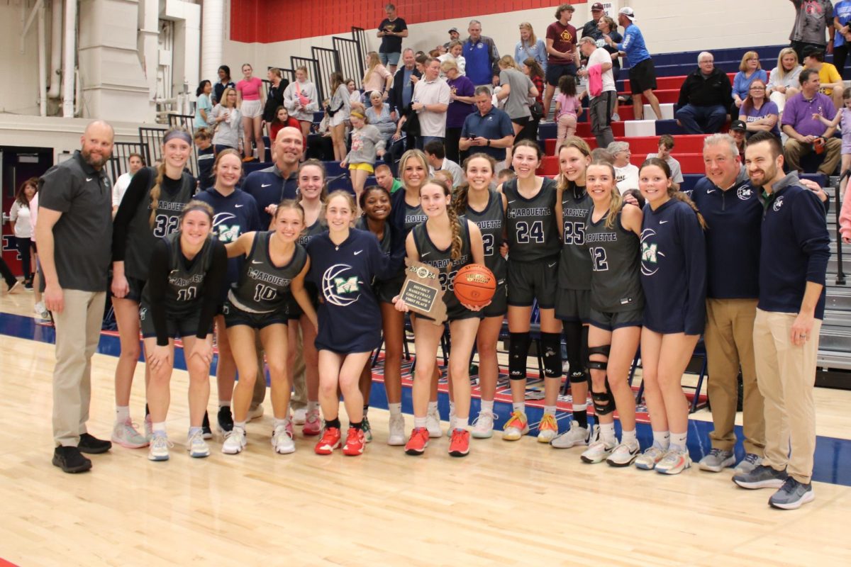 Varsity poses with their new district plaque on Monday, March 4 after defeating Eureka in the Class 6 District 2 Finals. The victory marked their first since 2021.