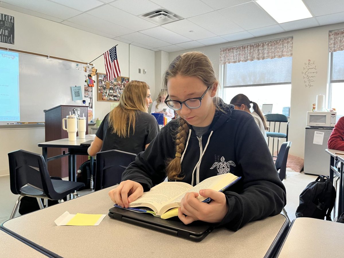 Abigail Lechy, sophomore, reads during her 10th Accelerated Language Arts class.
