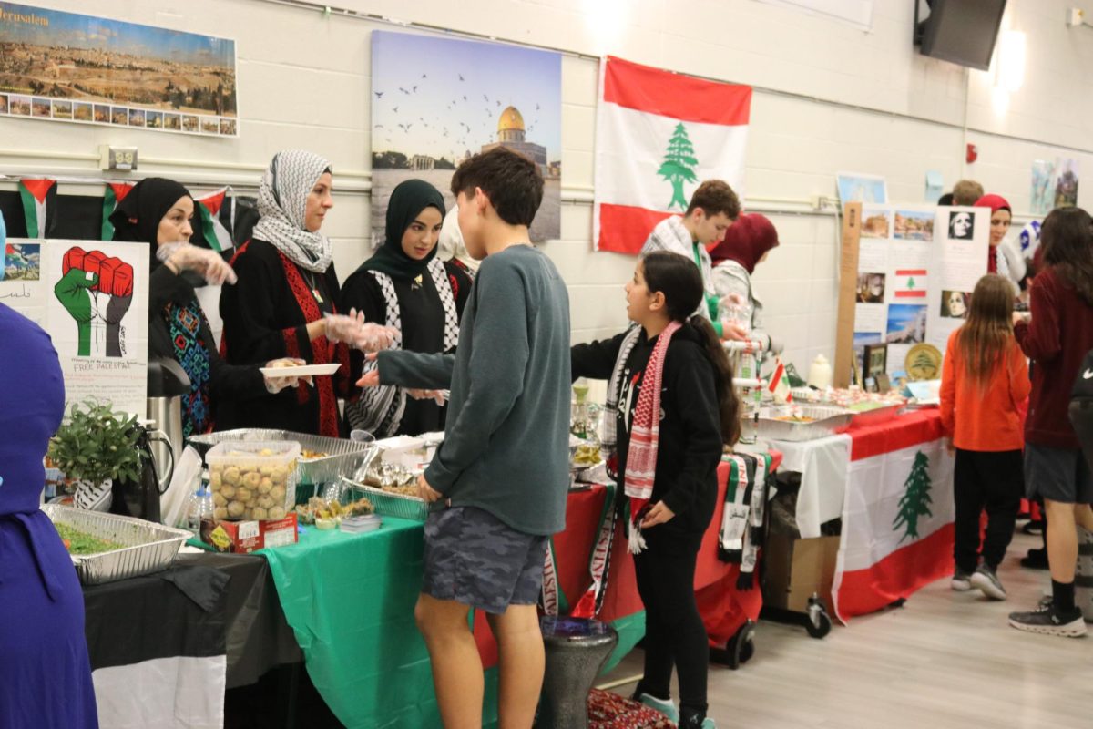 Attendees interact with booths based on different countries, where they were provided with food and information unique to each represented culture.