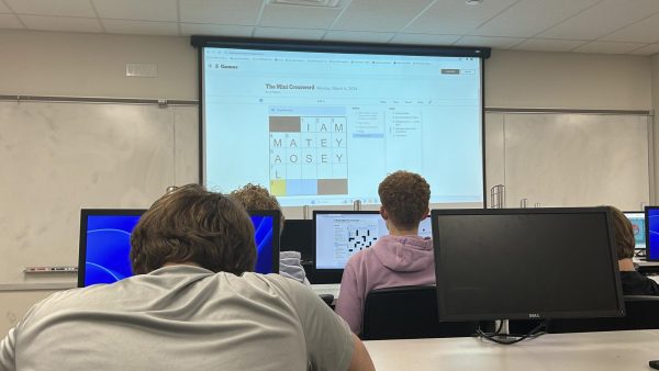 Catherine Chirco, engineering teacher, plays the New York Times Mini Crossword with her class.