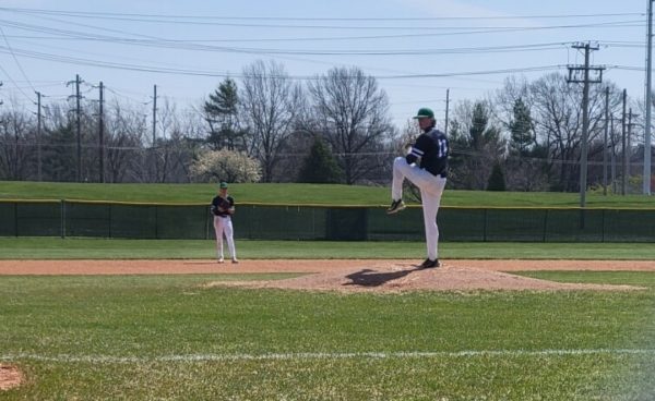 Aaron Akin, junior, pitches against Northwest on Friday, March 29. Akin threw a no-hitter, a game in which the pitcher does not give up a single hit. (Media By Jennifer Akin)