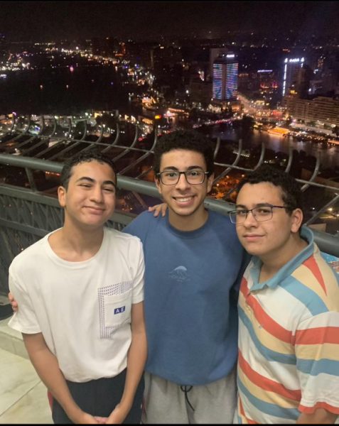Sophomores, Omar Elbeshbeshy (right) and Ramy Elbeshbeshy (left) with their older brother in Egypt.
