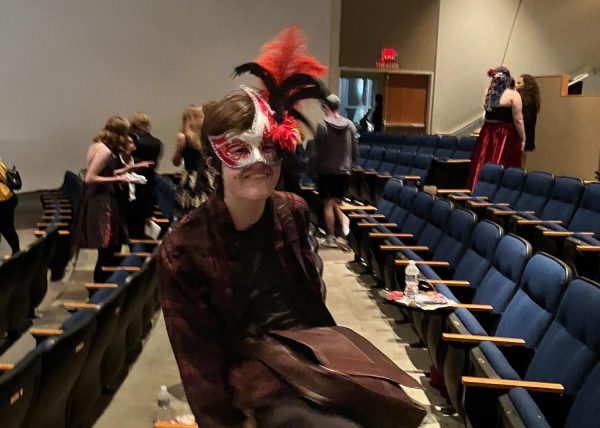 Aidan Gallagher, freshman, participates in the masquerade-themed banquet. At the banquet, Rebecca Blindauer, theater teacher, announced the shows for the 2024-2025 school year: “Peter and the Star Catcher and The Drowsy Chaperone.