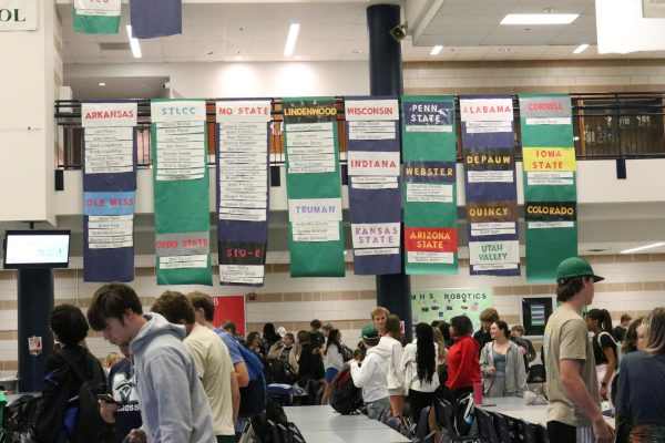 Each spring, the Community Service class creates posters to display the colleges that seniors will be attending in the fall. 
