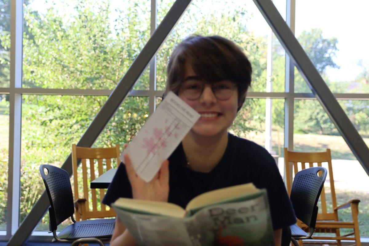 Madeleine Moss, sophomore, reads “Deer man,” a memoir about Geoffroy Delorme and his experience living in the wild with deer for seven years. 