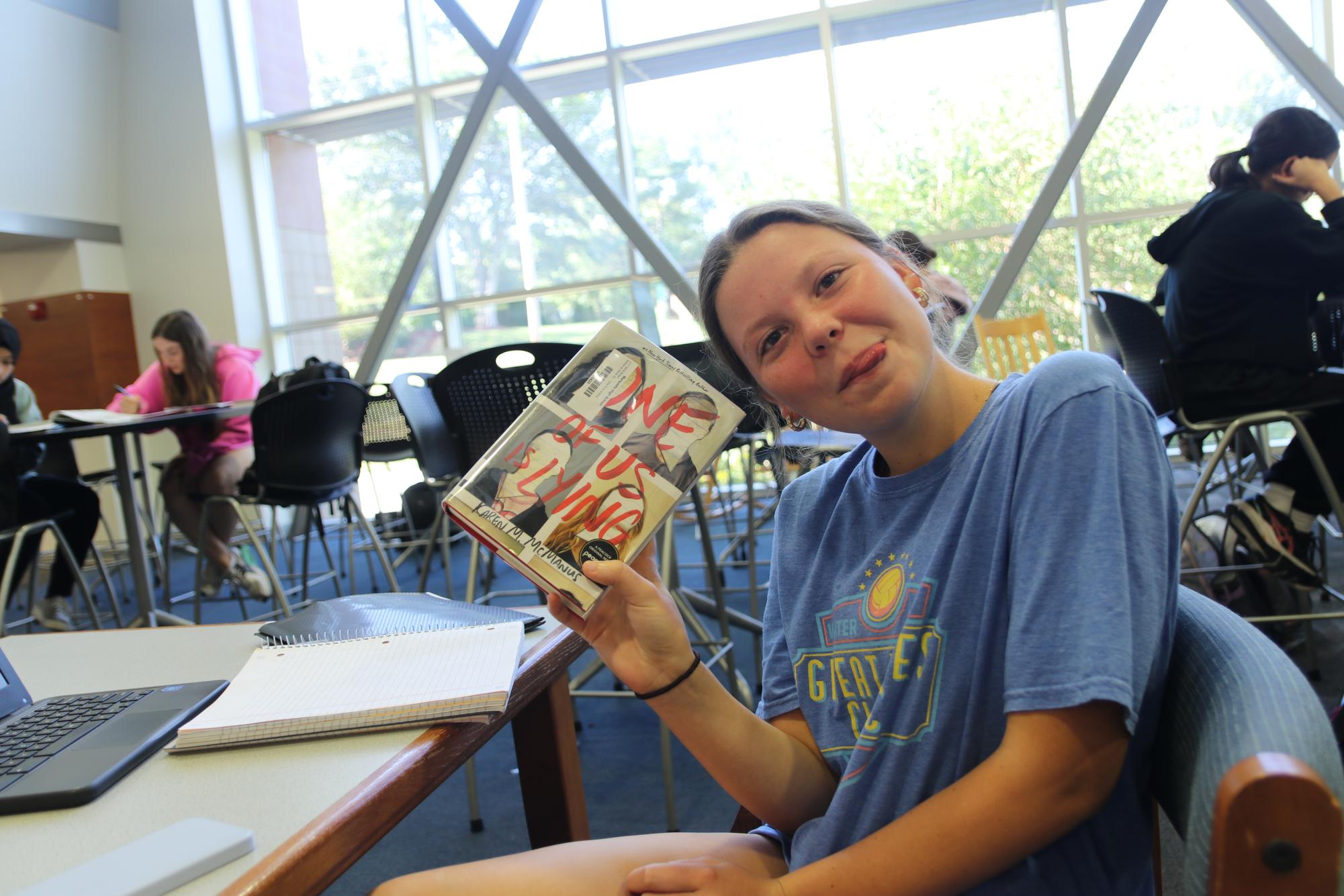 Mady Huff, senior, reads "One of Us is Lying," by Karen M. McManus. 