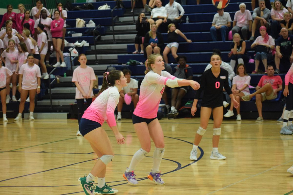 McKenzie Fitzmaurice, junior, saves the ball from hitting the floor, helping her team to score the point. “I was looking forward to the pink out game,” Fitzmaurice said. “It’s always fun playing Lafayette because they’re our biggest rivals.”