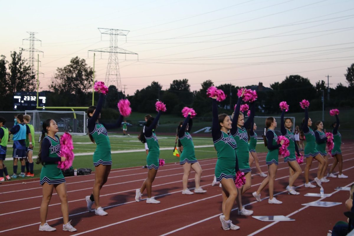 MHS varsity cheer participates in sideline cheer for football, soccer, and basketball games throughout the season, which helps the team prepare for their "game day" competition. 