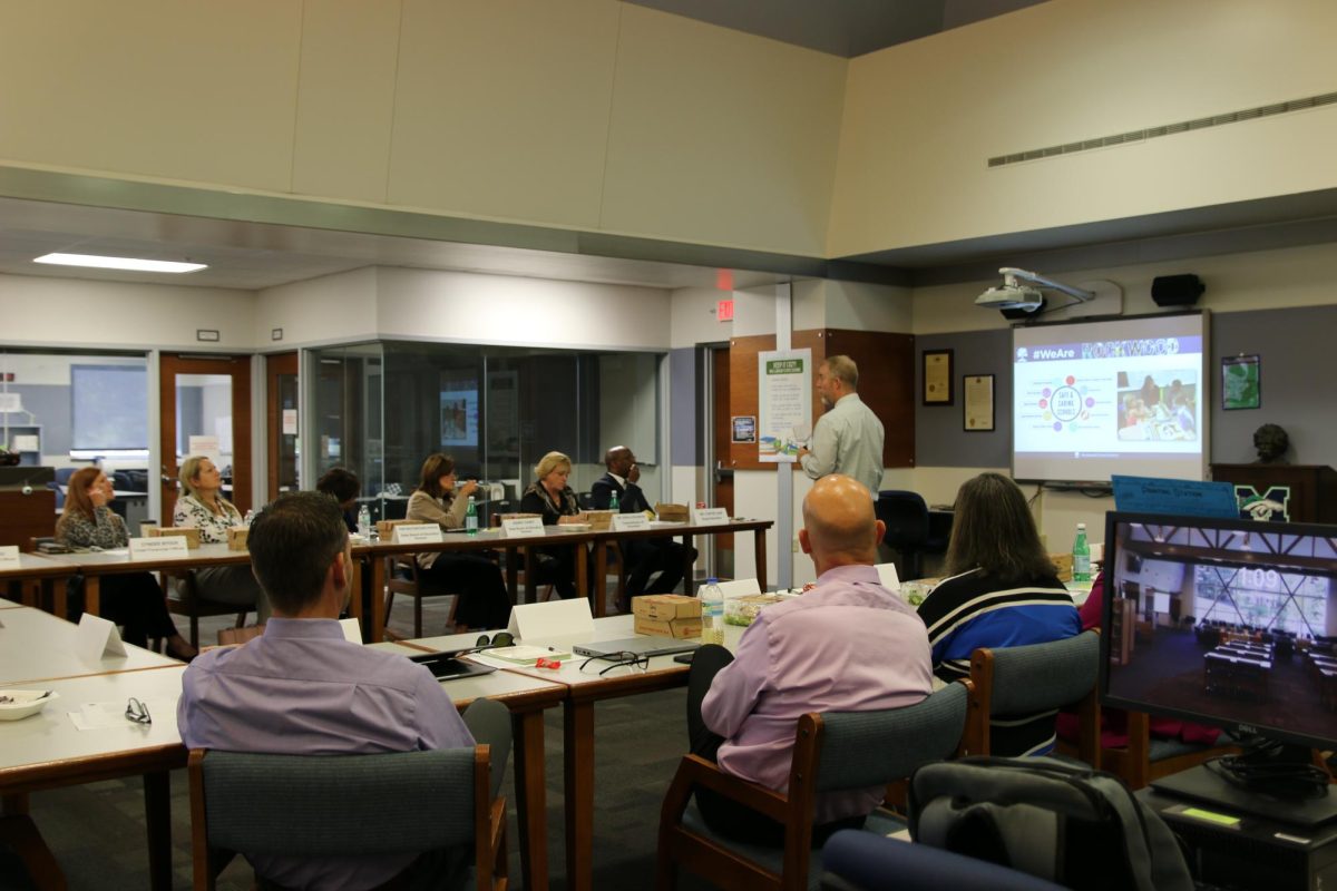 Assistant Superintendent of Student Services Dr. Steve Hankins presents information to the Missouri commissioner of education and three state board members in the Library today. The officials later toured the school, led by Principal Dr. Tracey Waeckerle.