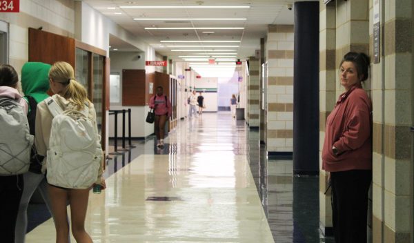 Kasey Mills, hall monitor, watches students as they go to third lunch. Hall monitors are among the many people and resources at MHS dedicated to ensuring the safety of students, Junior Principal Kyle Devine said.