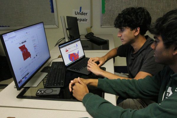 Seniors, Abhiram Permareddy (right) and Raj Gudavalli (left), analyze the votes for the Missouri Senate election and share their insights for the presidential race projections.