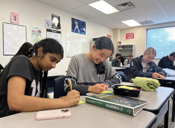 Juniors Keerthi Pakalapati, Jamie Park and Ellie Pagan (left to right) write Gratitude Grams in their Ac Lab homeroom. Students could choose to deliver the notes themselves or give them to Student Council members to deliver at a later date.