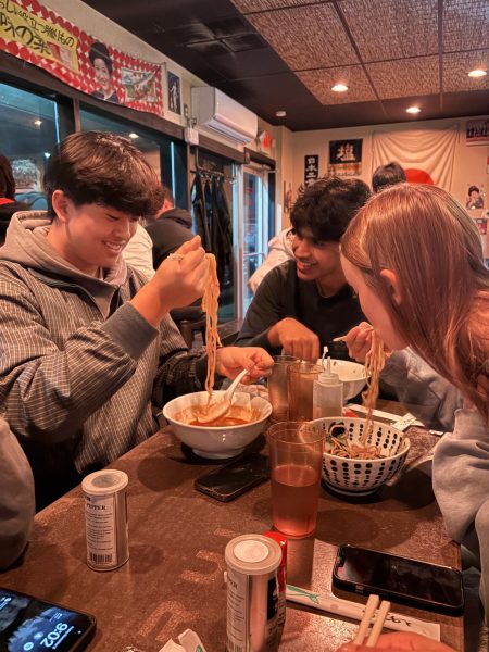 Seniors Henry Chen, Arush Singh, and Riley Gregory eat ramen together at Menya Rui after waiting in line for two hours.