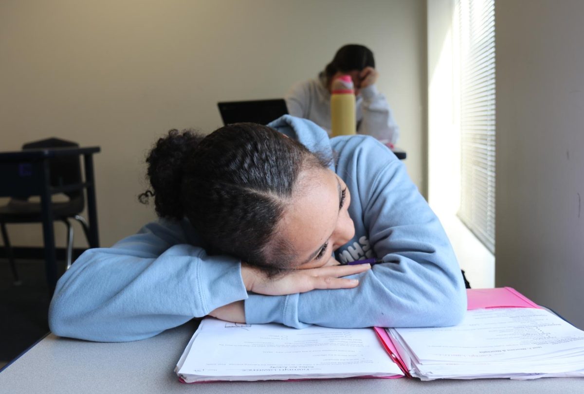 Kamryn Lawrence, junior, lays her head on her desk and stares out the window in her Study Hall class. Lawrence said that when shes bored she likes to hangout with friends, go on her phone and read.