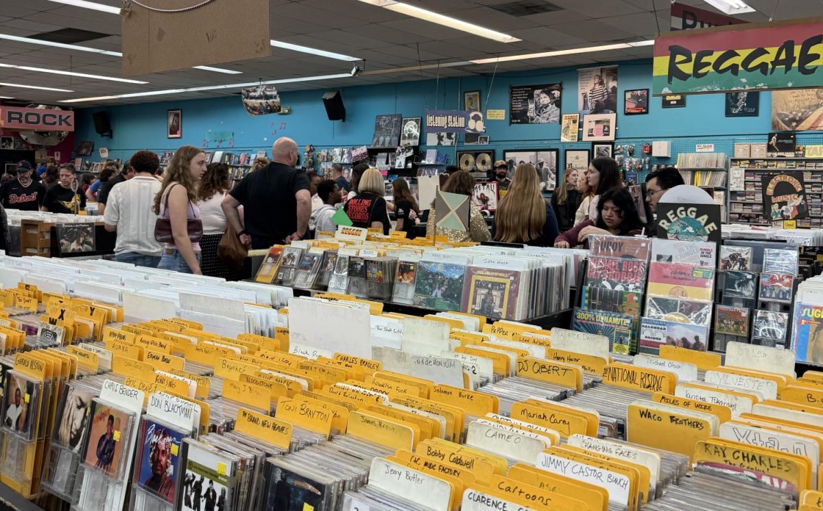 Fans attend a listening party for Harry Styles’ “Kiss All the Time. Disco, Occasionally” hosted by Vintage Vinyl on Friday, March 6. Attendees could enter a raffle to win  Styles merchandise while listening to the album with other fans. 