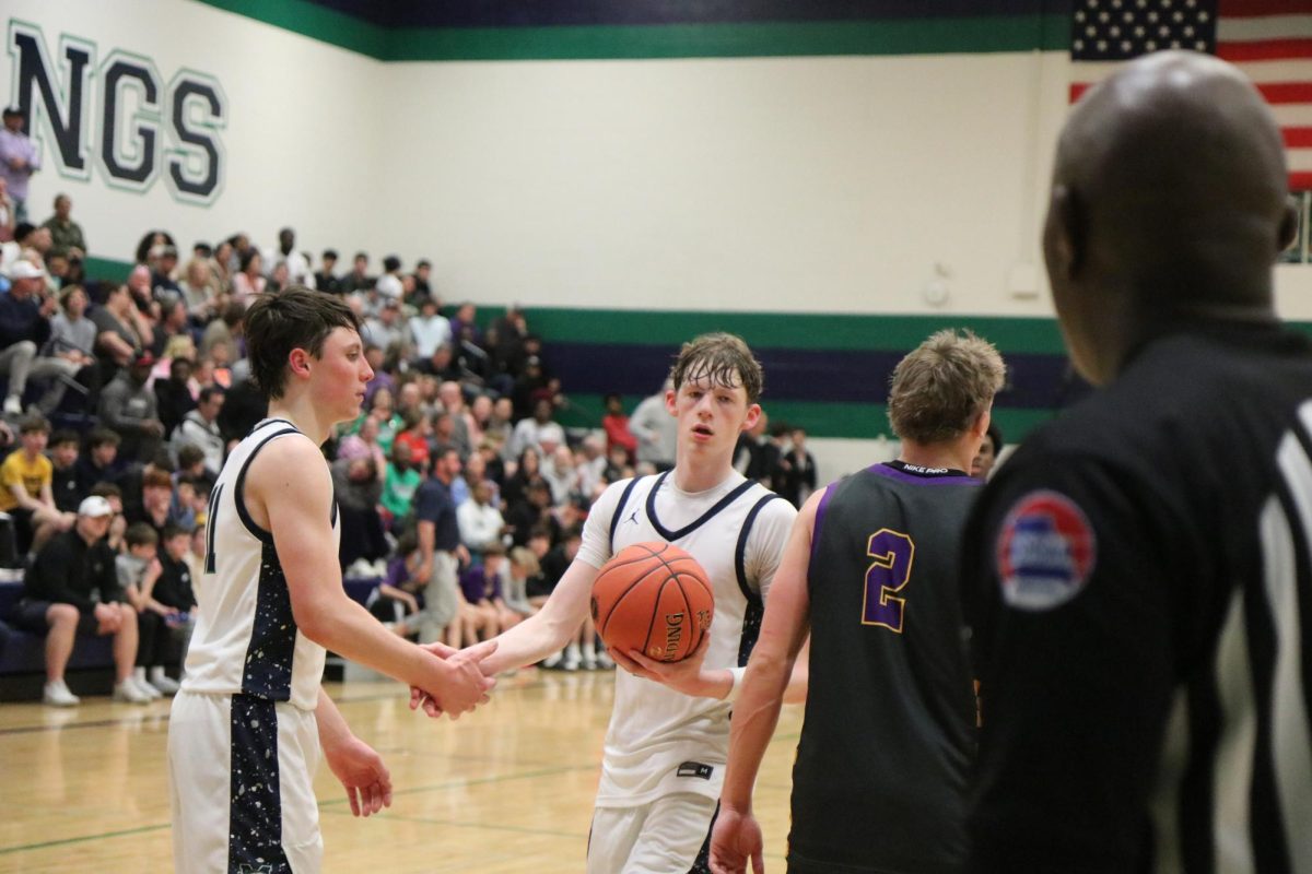 Seniors Brody Owen and Preston Loehr shake hands after a play during their game against Eureka on Thursday, March. 5. This game was a part of the Class 6 District 2 Tournament.