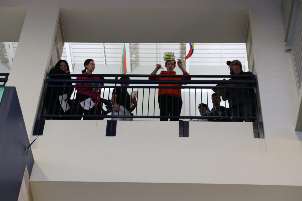 Daniel Perz, junior, drops his delivery system from the third floor. The system was made of cotton balls, pool noodles and straws.